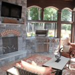 Interior of Screen Porch with Fireplace and Grill