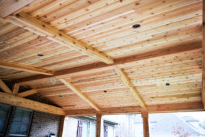 Before fans and stain, cedar covered porch ceiling